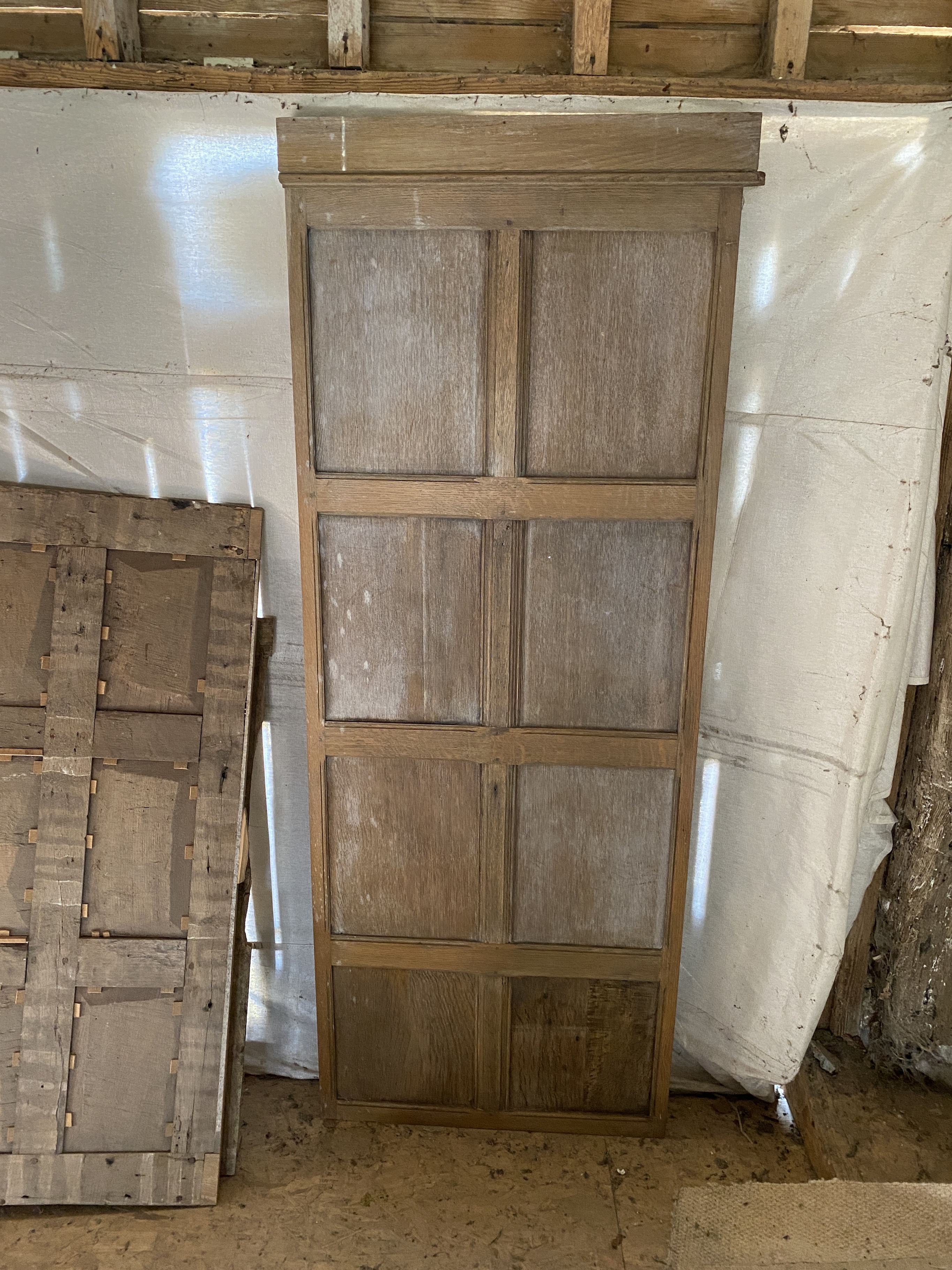 Oak panelling formerly in the library at Plumpton Place, as fitted to three walls in the room measuring, 585cm and two each of 440cm, individual sections of 192 x 72cm (the secret door); 258 x 110cm; 255 x 132cm; 260 x 1